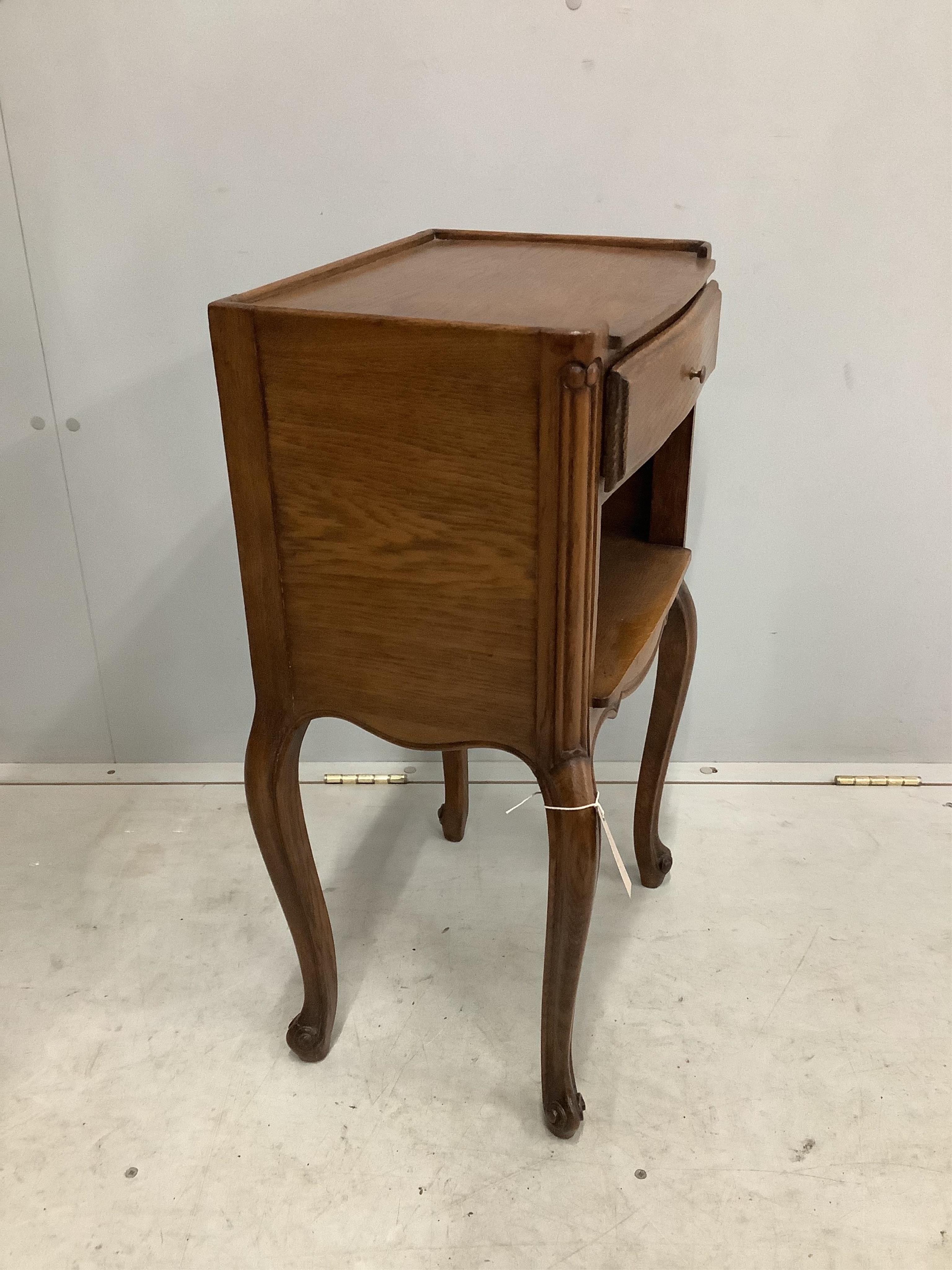 A pair of French oak bedside cabinets, width 38cm, depth 28cm, height 70cm. Condition - fair to good